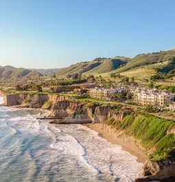 The ocean meets the cliffs of the shoreline at the Dolphin Bay Resort and Spa in California