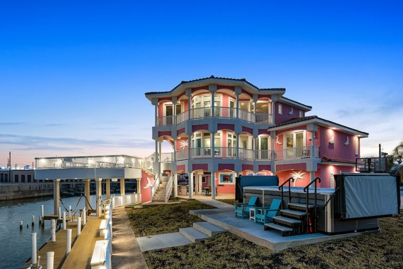 Bayfront home with dock, WiFi, private hot tub, & central AC