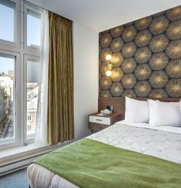 Interior of a hotel room with a city view