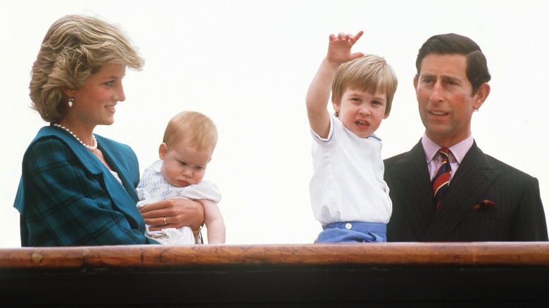 Princess Diana holding Harry, Prince Charles holding William