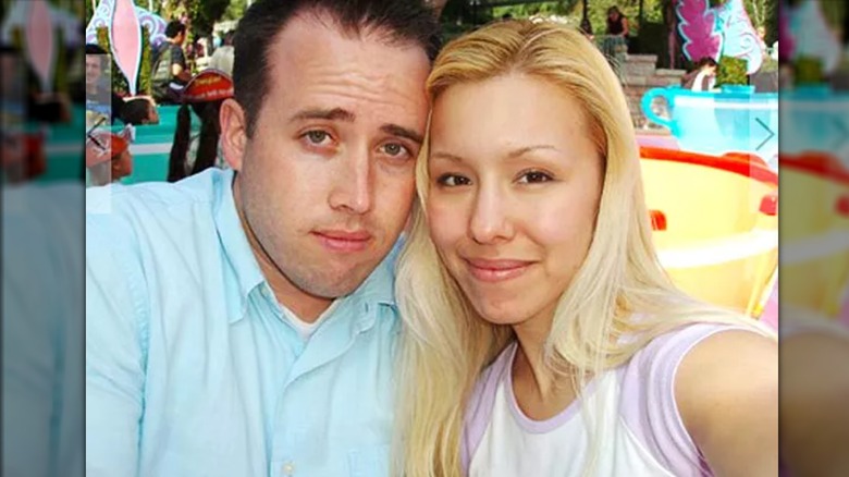 Jodi Arias posing with Travis Alexander at theme park