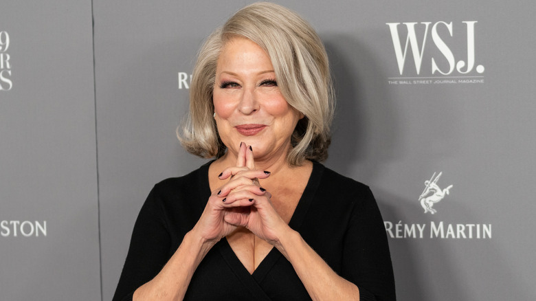 Bette Midler with hands clasped together