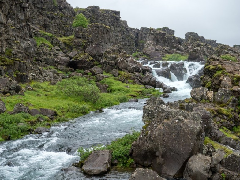 River running through volcanic landscape in Thingvellir National Park, Iceland
