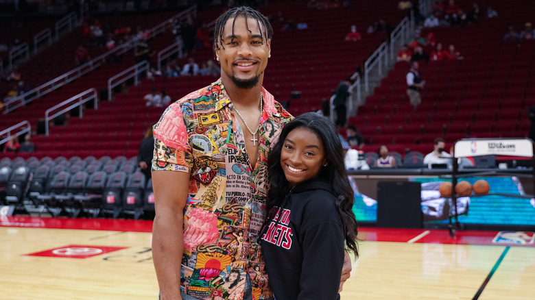 Jonathan Owens and Simone Biles smile