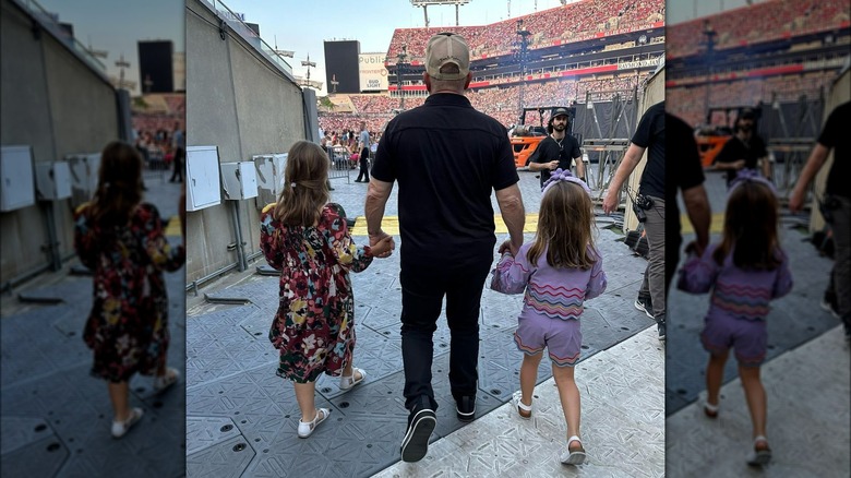 Billy Joel entering stadium with daughters