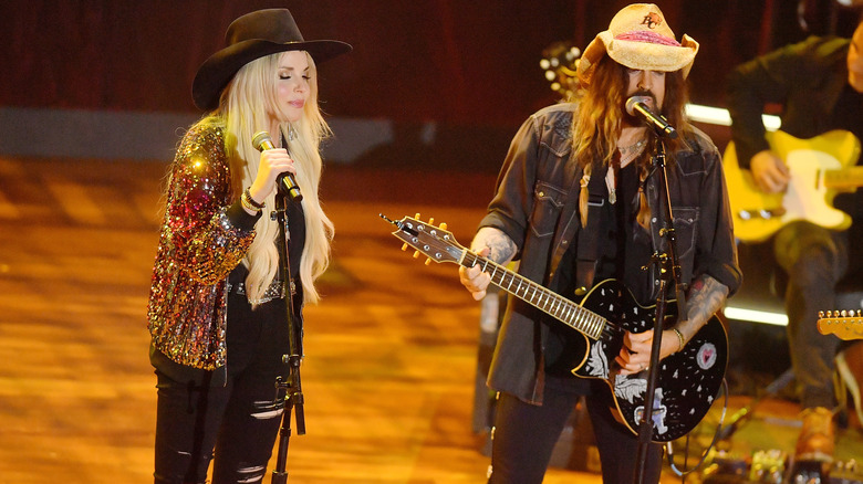 Billy Ray Cyrus and Firerose performing