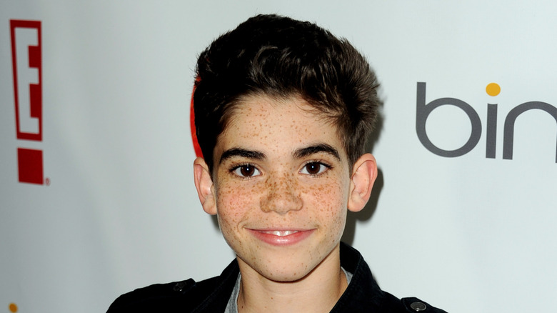 Cameron Boyce poses for a photo on the red carpet 