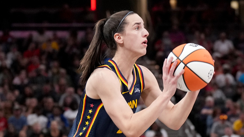 Caitlin Clark throwing a basketball