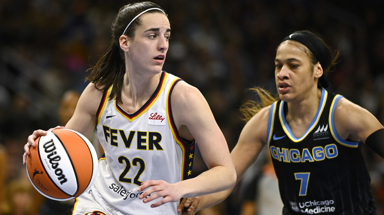 Caitlin Clark and Chennedy Carter playing basketball