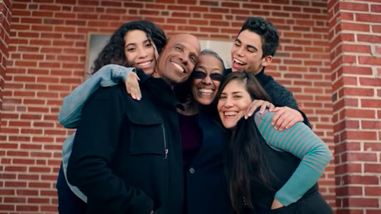 Cameron Boyce and Jo Ann Crazier pose alongside members of "The Clinton 12"