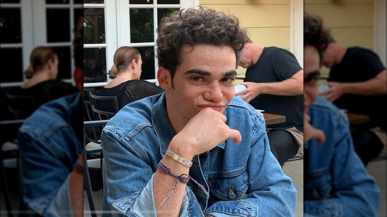 Cameron Boyce seated in restaurant