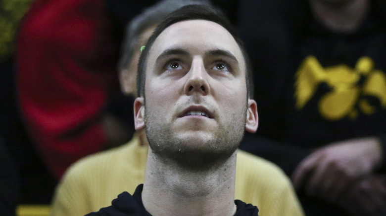 Connor McCaffery watching Caitlin Clark on court