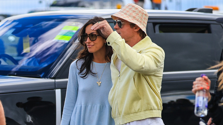 Ines de Ramon and Brad Pitt wearing shades