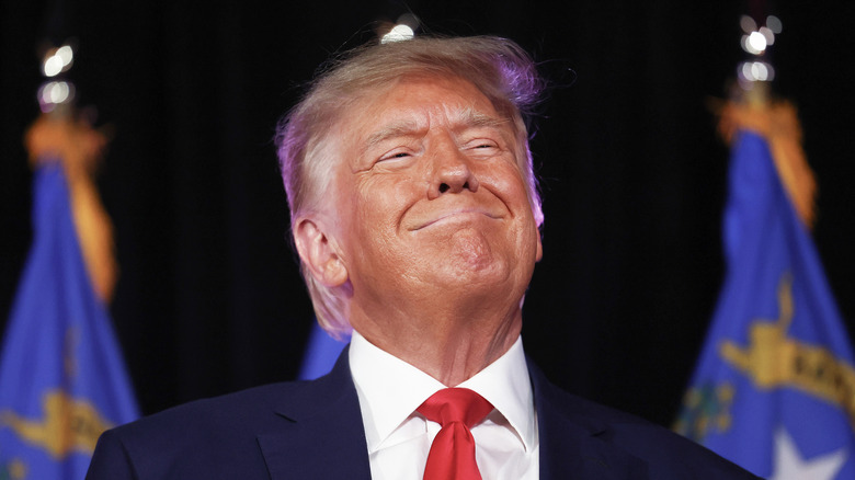 Donald Trump smiling malevolently