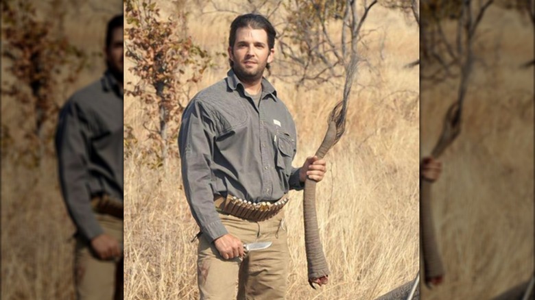 Donald Trump Jr. poses with an elephant tail