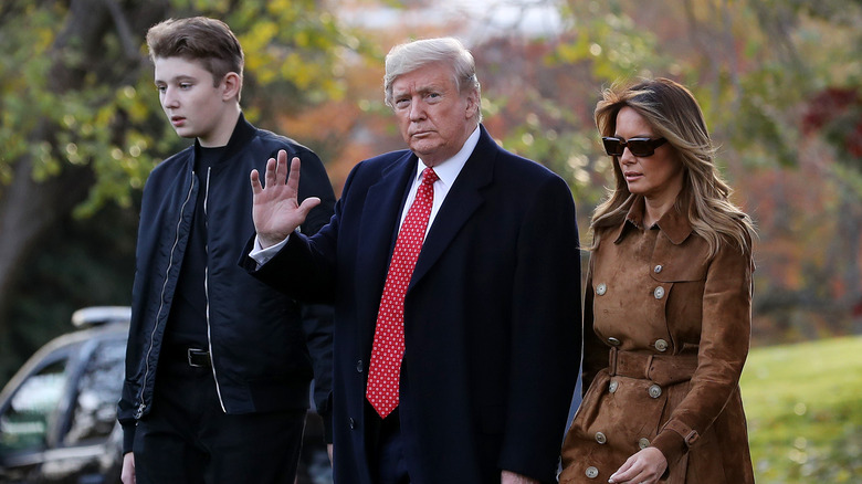 Barron, Donald, and Melania Trump walking