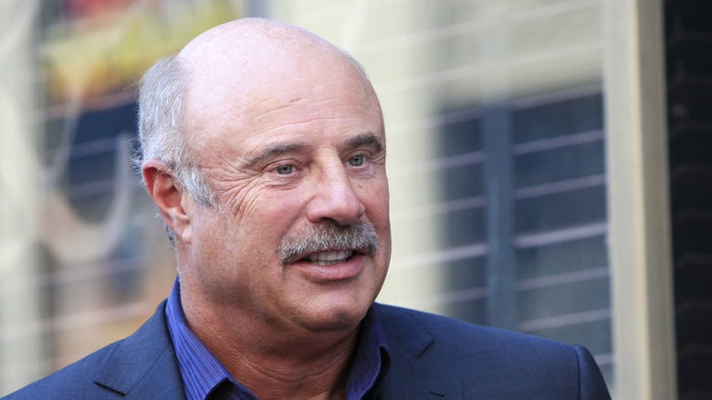 Dr. Phil smiling in 2013