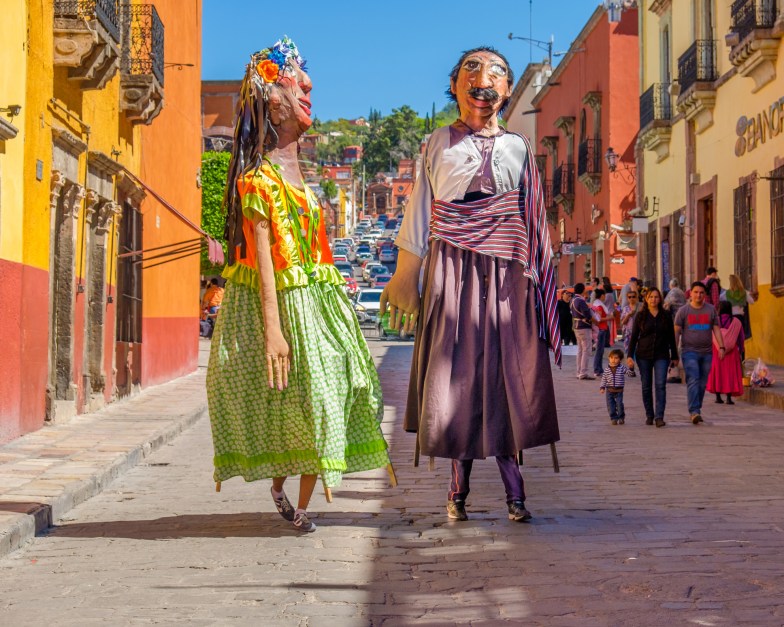 Mojigangas walk through San Miguel de Allende, Mexico
