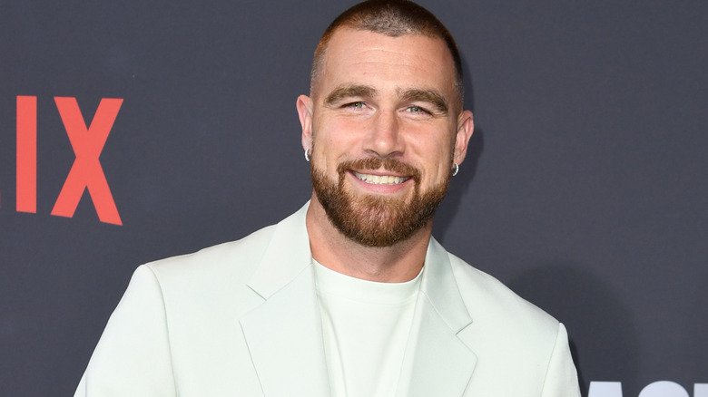 Travis Kelce in a white suit