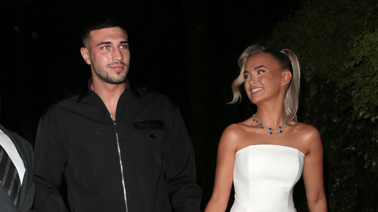 Tommy Fury holding Molly-Mae's hand