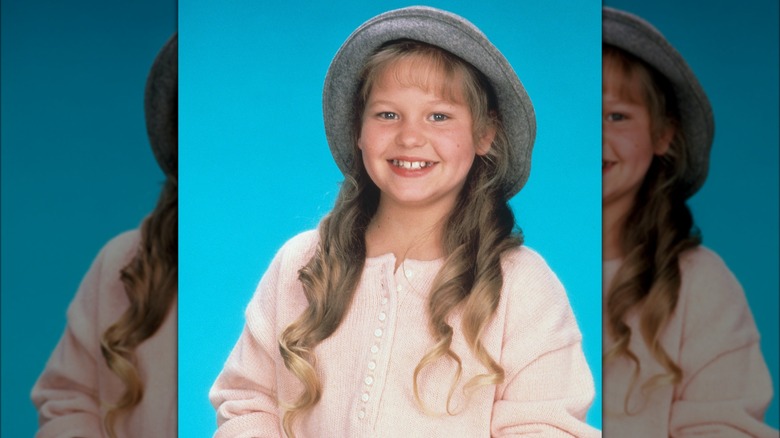 Candace Cameron Bure smiling wearing hat in 1987