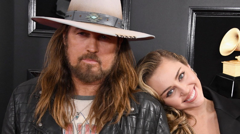 Billy Ray posing with Miley Cyrus