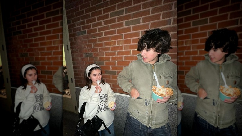 Mason Disick, posing with Penelope Disick