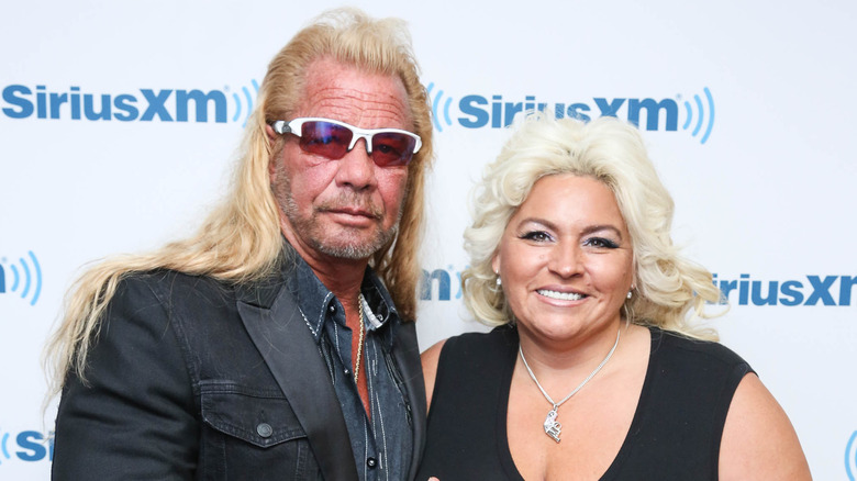 Dog the Bounty Hunter and Beth Chapman posing