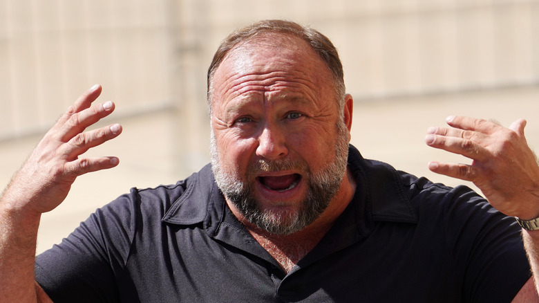 Infowars host Alex Jones gesturing