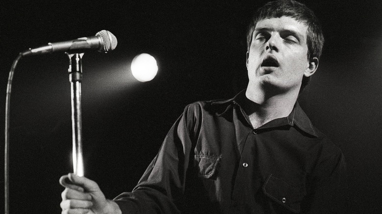 Ian Curtis performing onstage