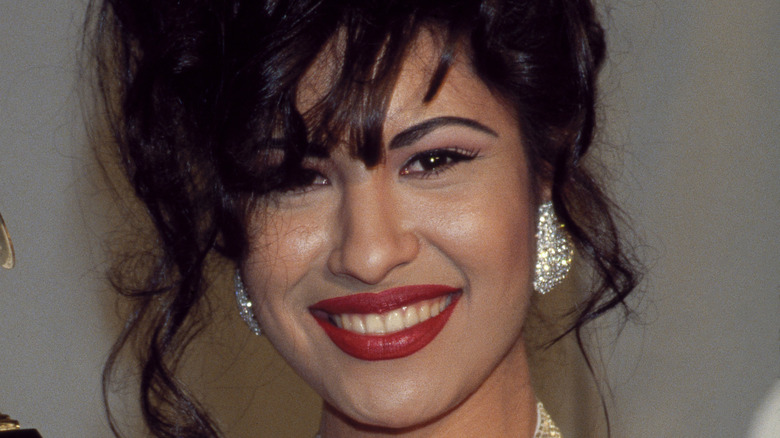 Selena Quintanilla-Pérez posing with her Grammy