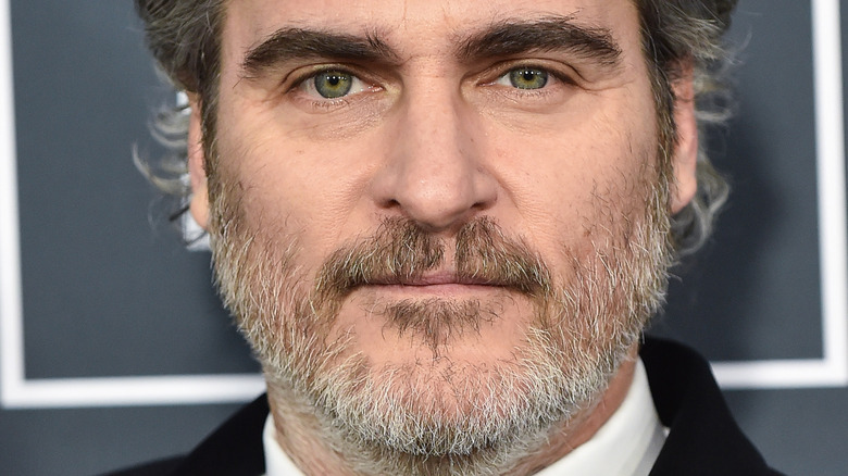 Joaquin Phoenix smiling white beard