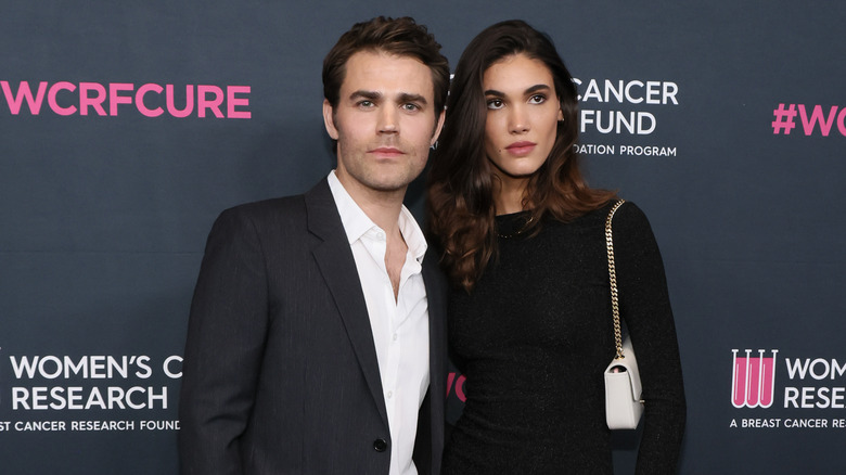 Paul Wesley and Natalie Kuckenburg posing