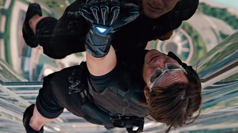 Tom Cruise as Ethan Hunt scaling the Burj Khalifa