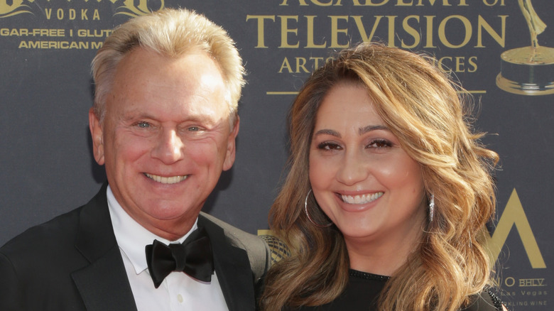 Pat Sajak and Lesly Brown posing