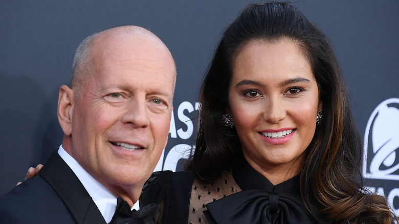 Bruce Willis and Emma Heming Willis smiling