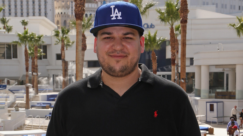 Rob Kardashian wearing a blue hat