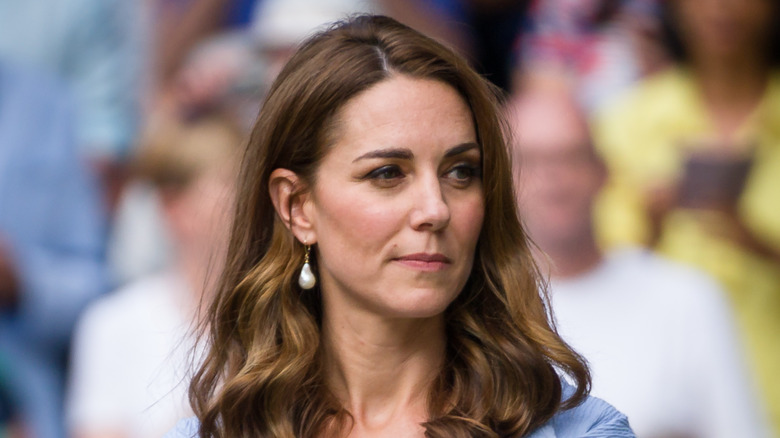 Kate Middleton looking on