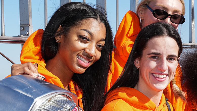 Angel Reese and Caitlin Clark smiling