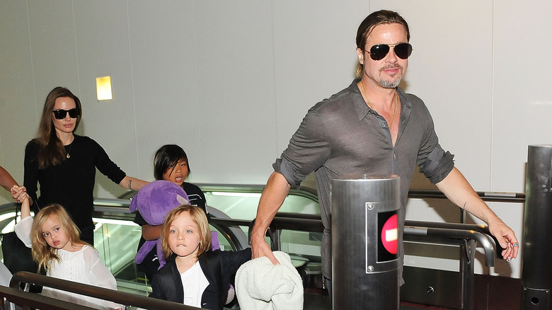 Brad Pitt with Pax, Knox, and Vivienne Jolie-Pitt, and Angelina Jolie