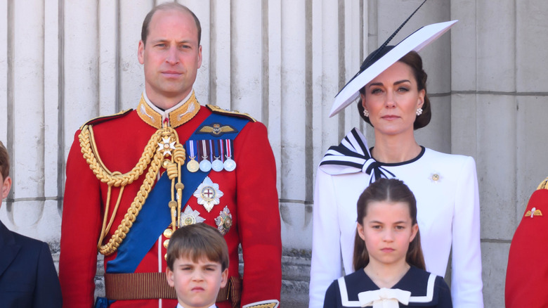 Prince William grimacing beside Kate Middleton