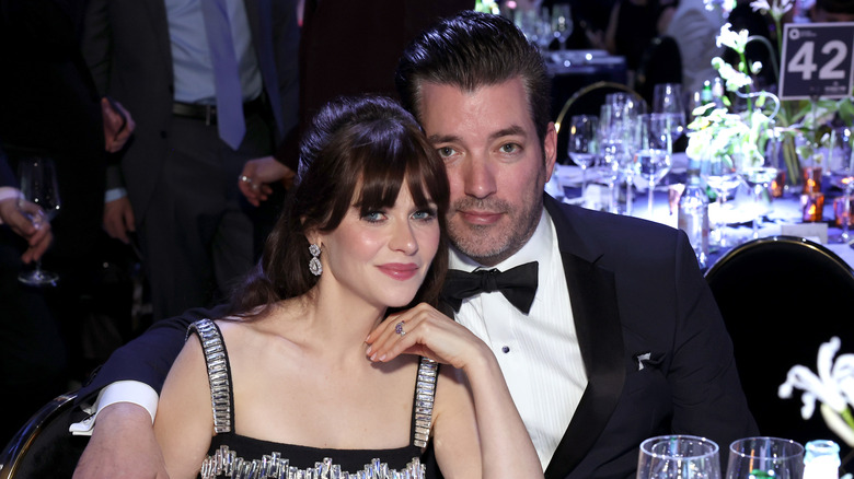 Jonathan Scott with arm around Zooey Deschanel