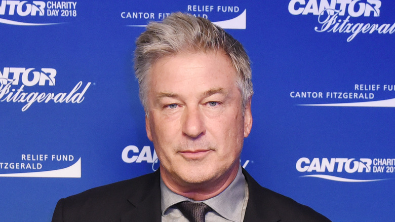 Alec Baldwin gray shirt black suit