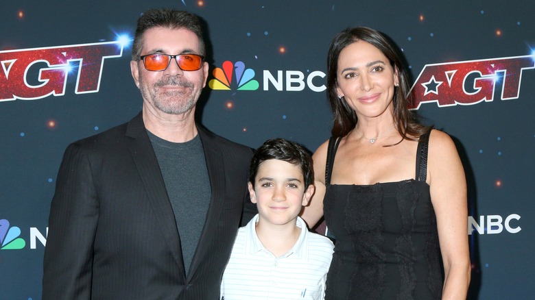 Eric Cowell, Simon Cowell, and Lauren Silverman posing together