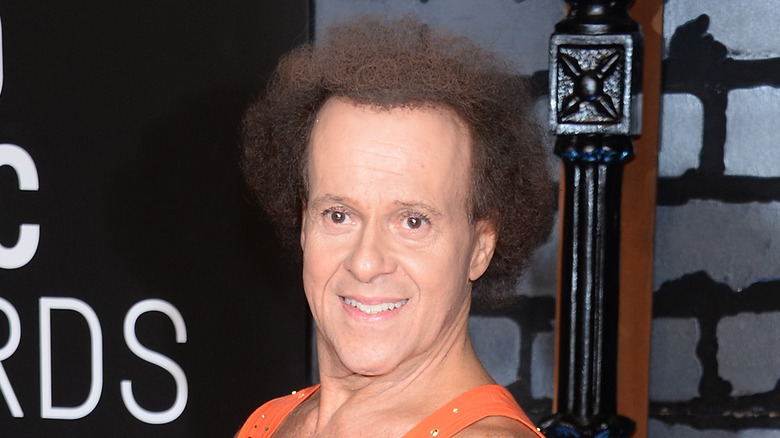 Richard Simmons orange tank top