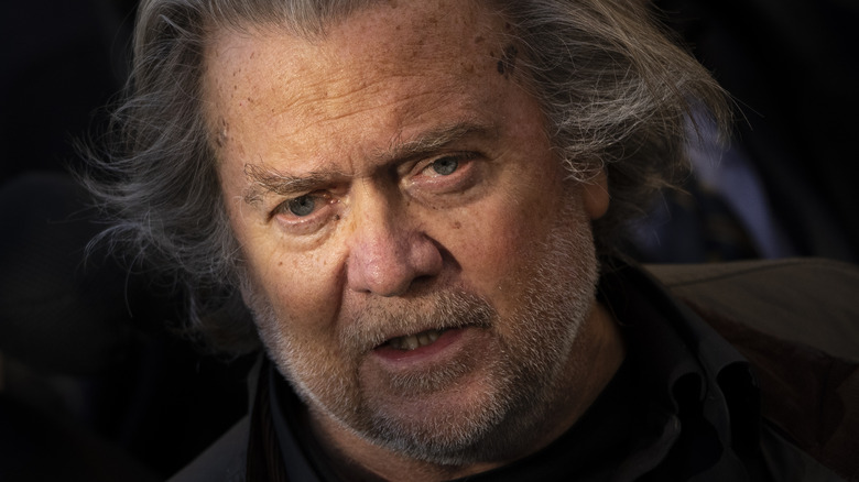 Steve Bannon long hair glum