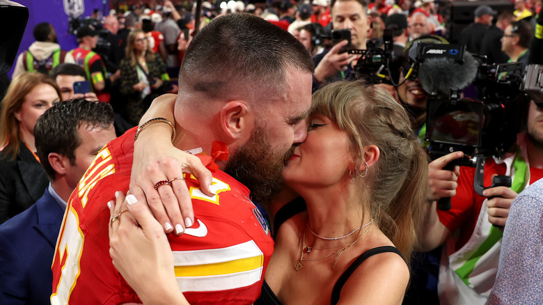 Taylor Swift kissing Travis Kelce after the Super Bowl in 2024