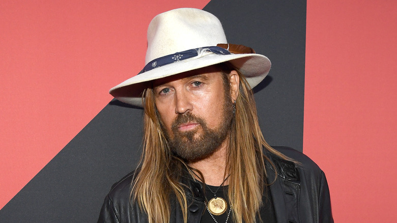 Billy Ray Cyrus poses on red carpet