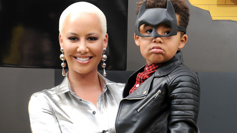 Amber Rose holding her son