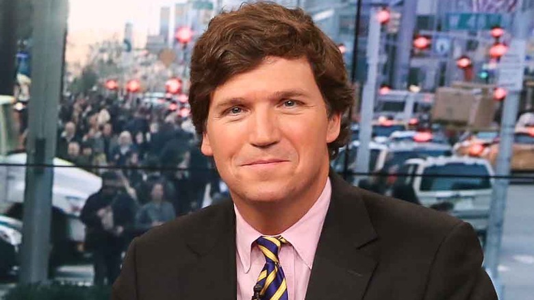 Tucker Carlson smirking